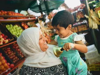 mother and daughter connecting with each other at outside market